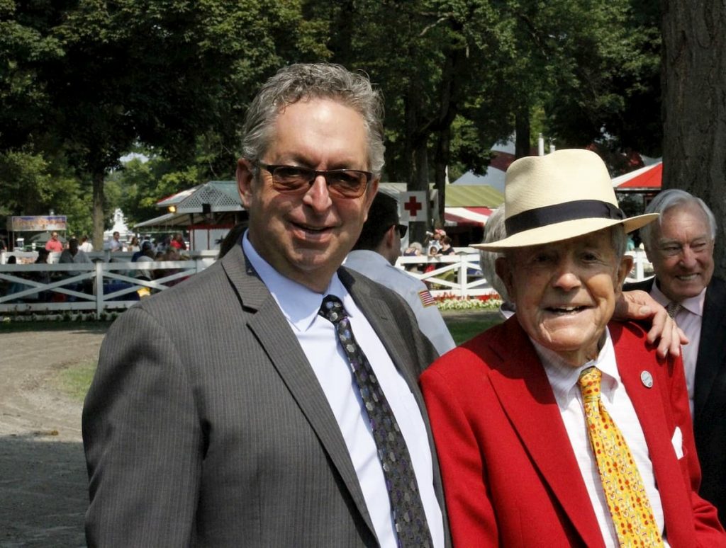 alt="NYRA horse trainer Gary Contessa standing at Saratoga with Cot Campbell"