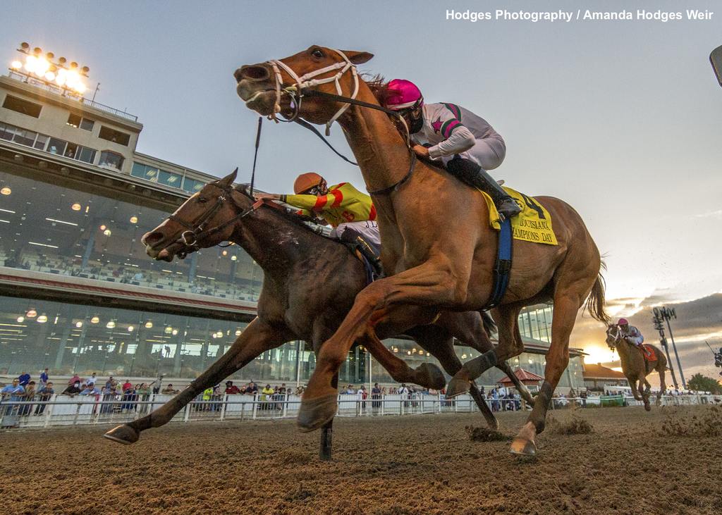 Ova Charged with J. A. Guerrero aboard gets a head in front of Basalt Street to win the17th running of the $100,000 Louisiana Champions Day Ladies Sprint. (Hodges Photography / Amanda Hodges Weir)
