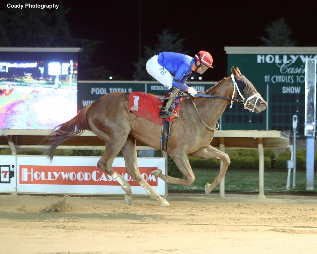 Uncaptured Storm winning an allowance race on June 3 at Charles Town, with jockey Arnaldo Bocachica. (The silks in this race are trainer Anthony Farrior's.) (Coady Photography)