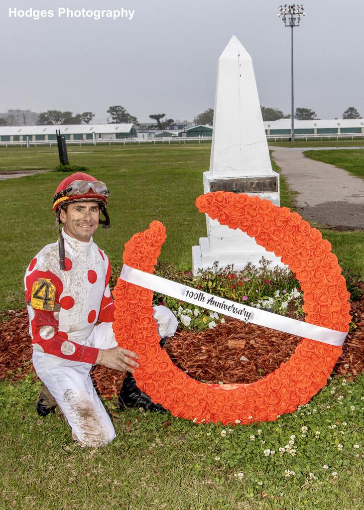 3/2/2024 - To commemorate the 100th anniversary of Black Gold victories in the Louisiana and Kentucky Derbys, Corey Lanerie places a wreath on Black Gold's grave after winning the 66th running of the Black Gold Stakes aboard Camaro Z at Fair Grounds. Hodges Photography