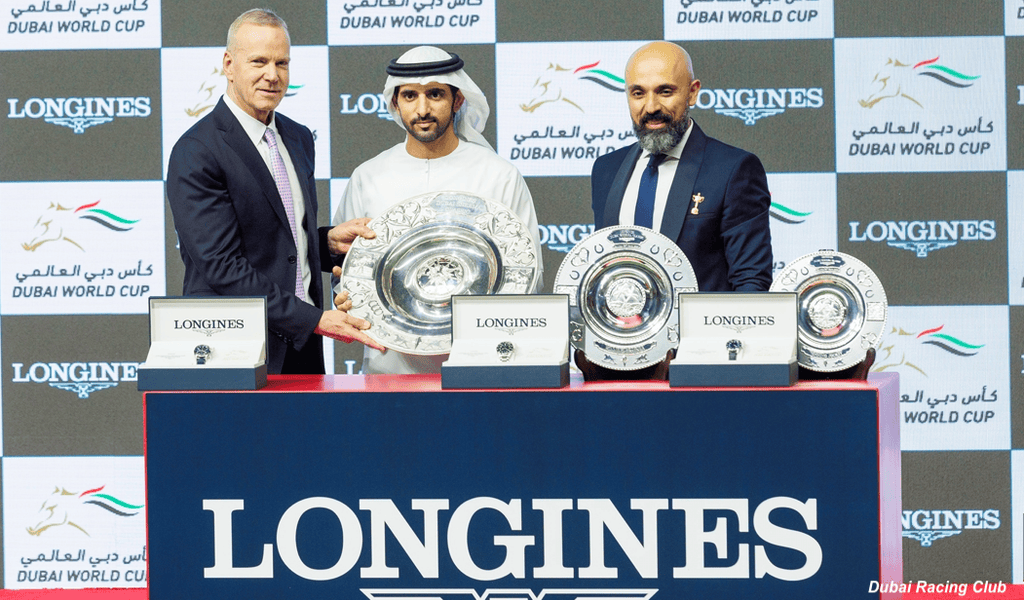 HH Sheikh Hamdan bin Mohammed bin Rashid Al Maktoum receives the Longines Dubai Sheema Classic trophy. (Dubai Racing Club)
