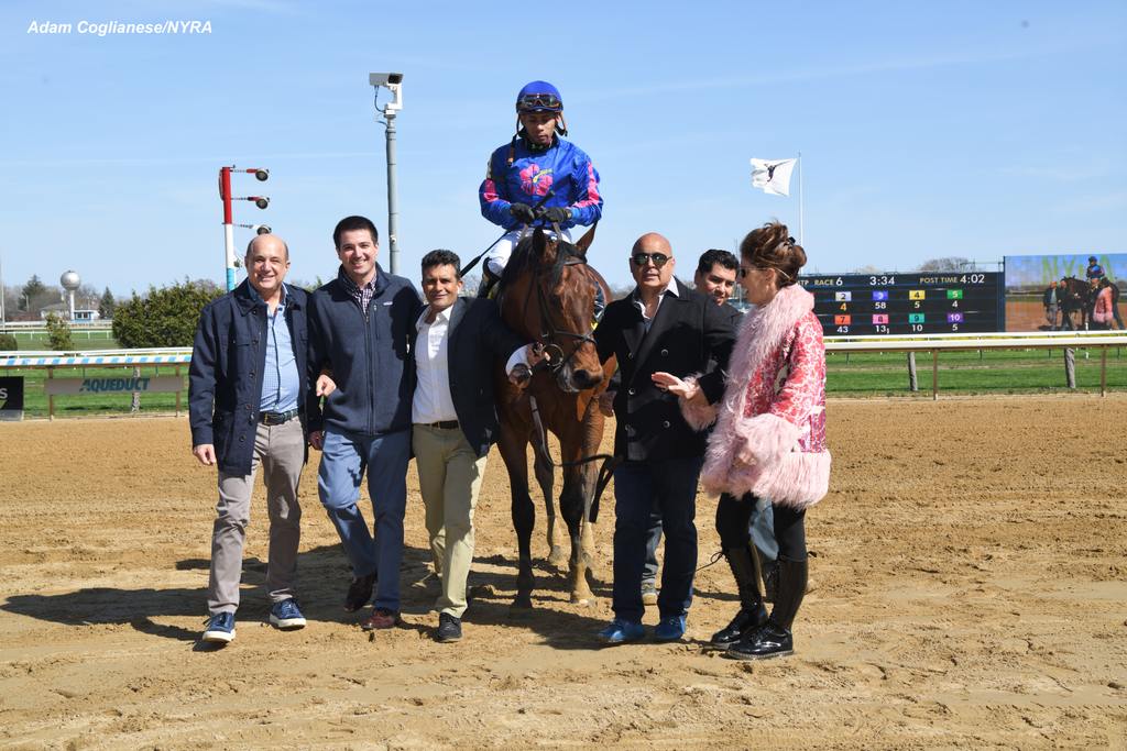 The walk to the winner's circle with connections. (Adam Coglianese)