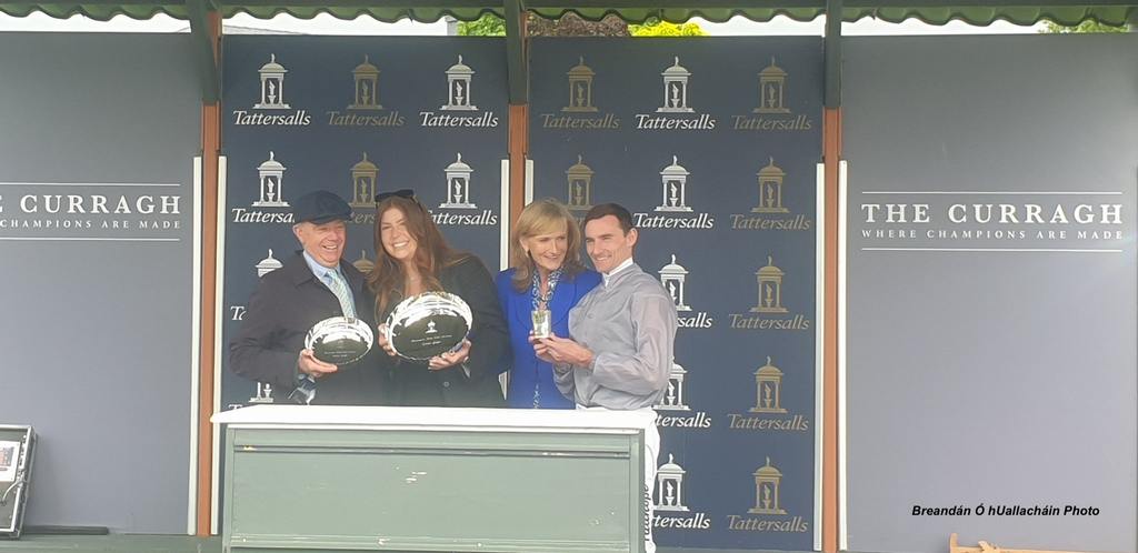 Winning connections receive their prizes, with trainer Karl Burke on the left and winning jockey Danny Tudhope on the right. (Breandán Ó hUallacháin Photo)