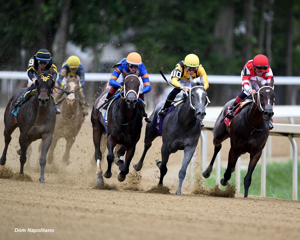 Davis (orange cap) and The Queens M G find the gap and the path to victory. (Dom Napolitano)