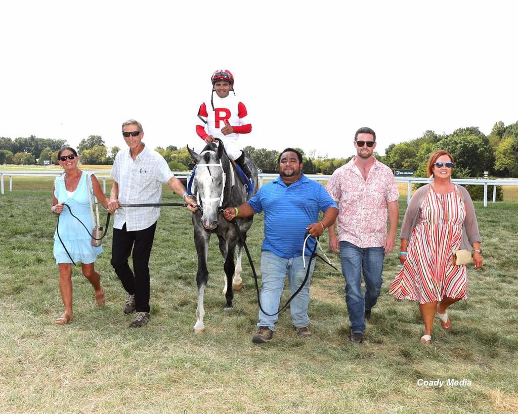 Walking Degree of Risk into the winner's circle. Nolan Ramsey is second from right. (Coady Media)